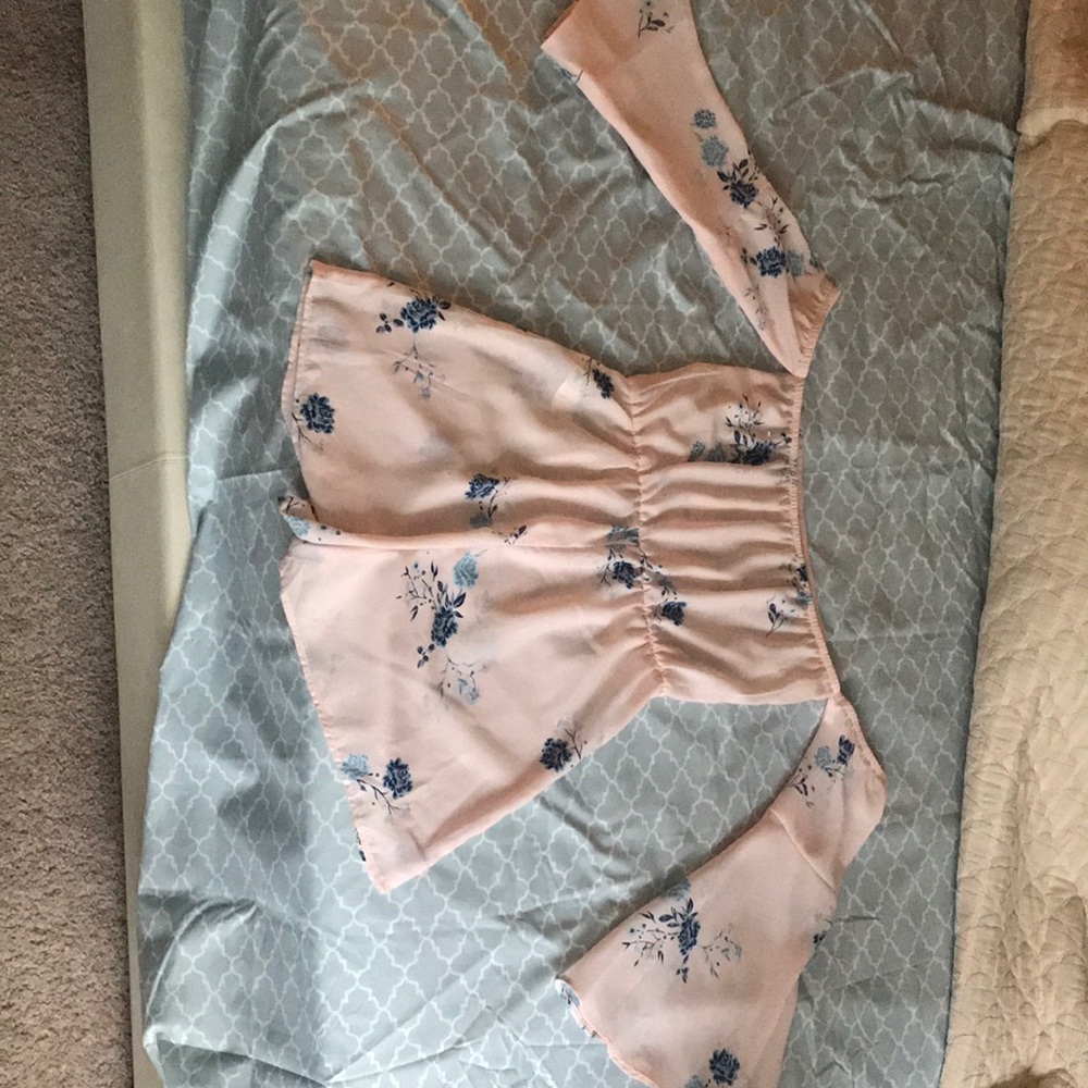 Romper with sleeves attached to it